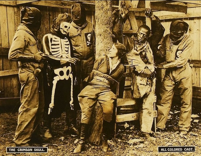 Cast members of "The Crimson Skull including Lawrence Chenault (in the skeleton suit) and the beautiful Anita Bush.